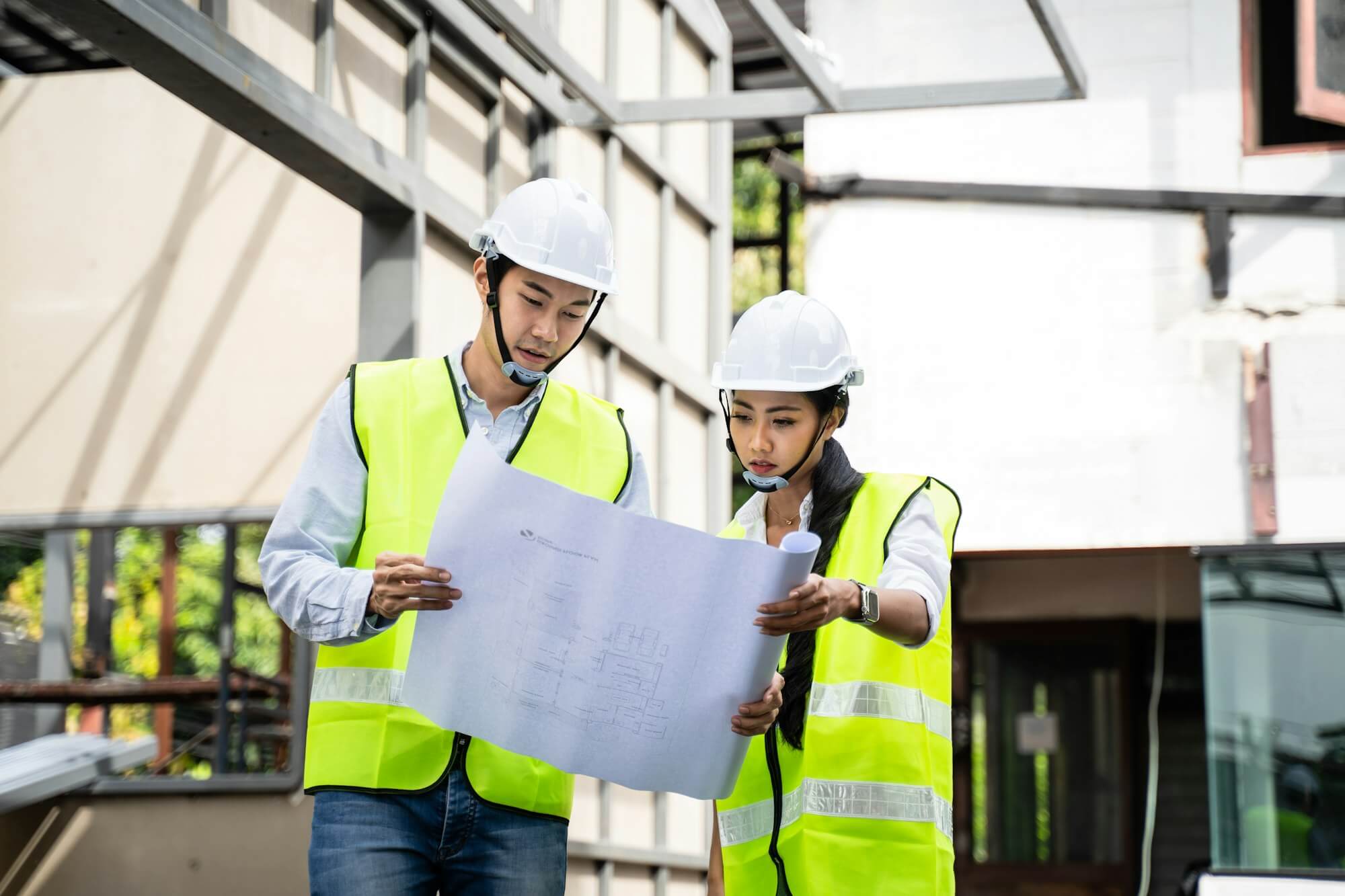 asian-colleague-workers-people-wearing-protective-safety-helmet-and-glasses-onsite-of-architecture-.jpg