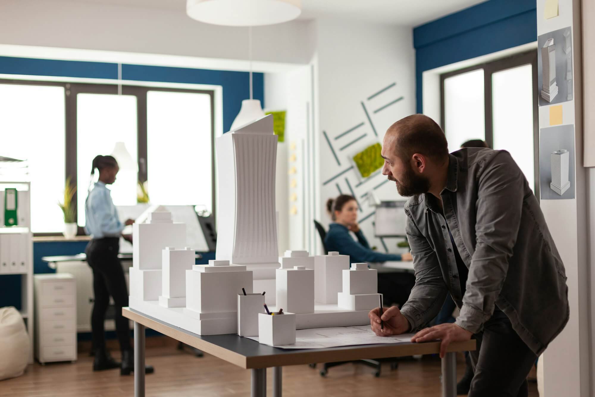 man-working-on-architectural-design-at-office.jpg